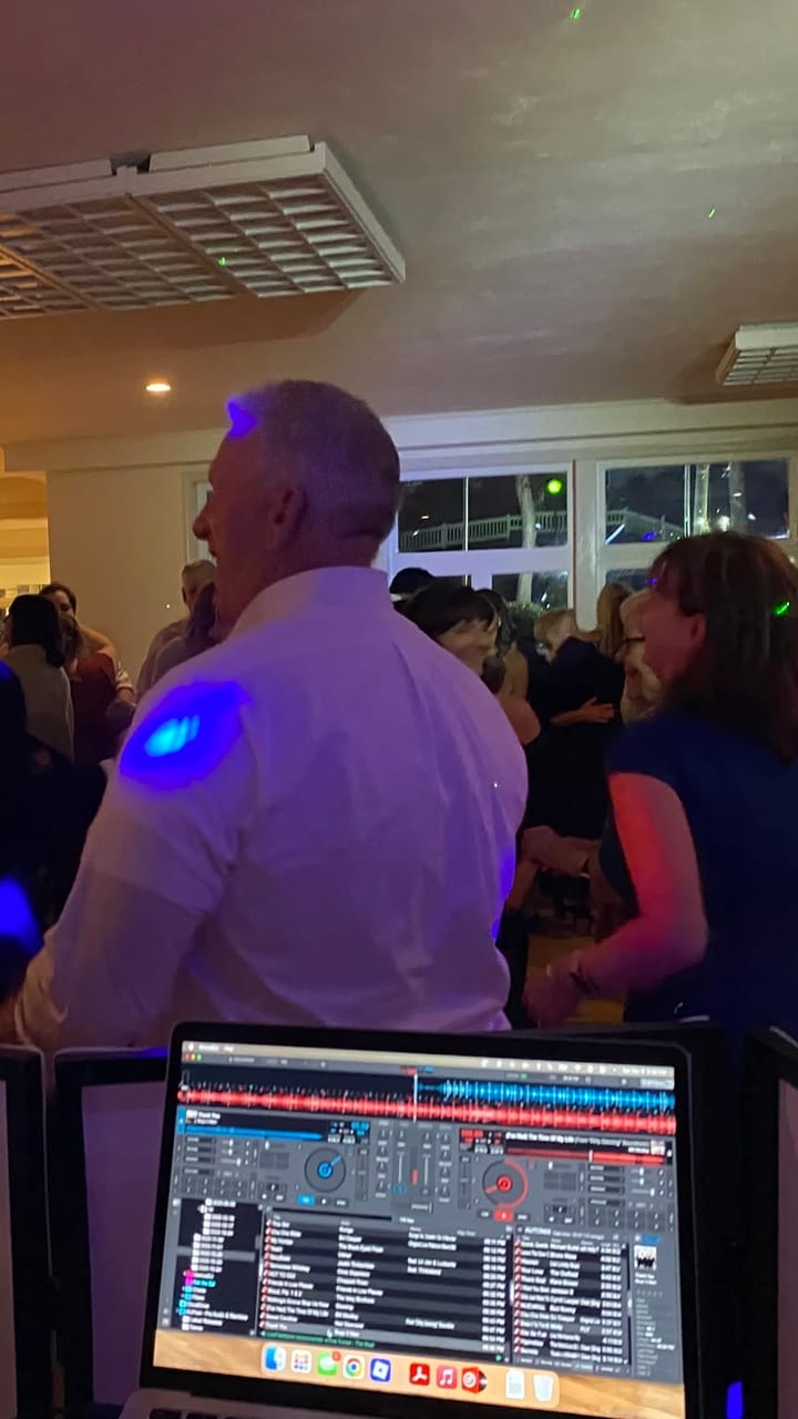 The view from behind the booth, out over a full dance floor