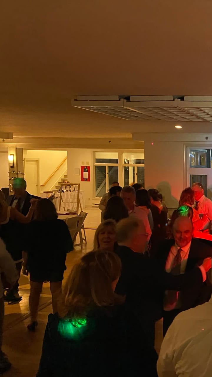 A full function room under colored uplighting